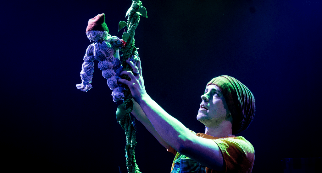 Sam Butters holding Jack puppet on the beanstalk.